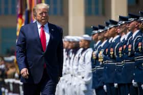 President Donald Trump reviews service members during a Pentagon ceremony in 2019.