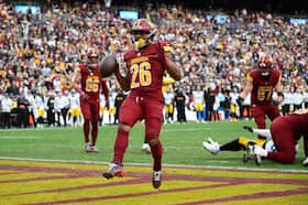 Washington Commanders running back Jeremy McNichols scores on a 1-yard run against the Pittsburgh Steelers at Northwest Stadium in Landover on Sunday. (Nick Wass/AP)