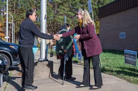 Rep. Abigail Spanberger (D-Virginia) greets a voter in Woodbridge on Nov. 8, 2022. (Craig Hudson for The Washington Post)