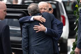 President Joe Biden hugs his son Hunter Biden as they leave a restaurant in Los Angeles on Feb. 4. (Saul Loeb/AFP/Getty Images)