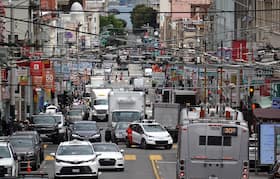 A Chevrolet Cruise autonomous vehicle with a driver moves through an intersection on June 8, 2023, in San Francisco.