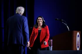 Former Hawaii congresswoman Tulsi Gabbard greets Donald Trump onstage in Detroit on Aug. 26. (Tom Brenner for The Washington Post)