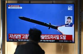 A TV news broadcast at a train station in Seoul on Thursday shows old footage of a North Korean missile test.