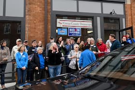 Chairman of the Democratic Party of Wisconsin Ben Wikler (right in plaid shirt) on April 20 in Monroe, Wisconsin. (Joshua Lott/The Washington Post)